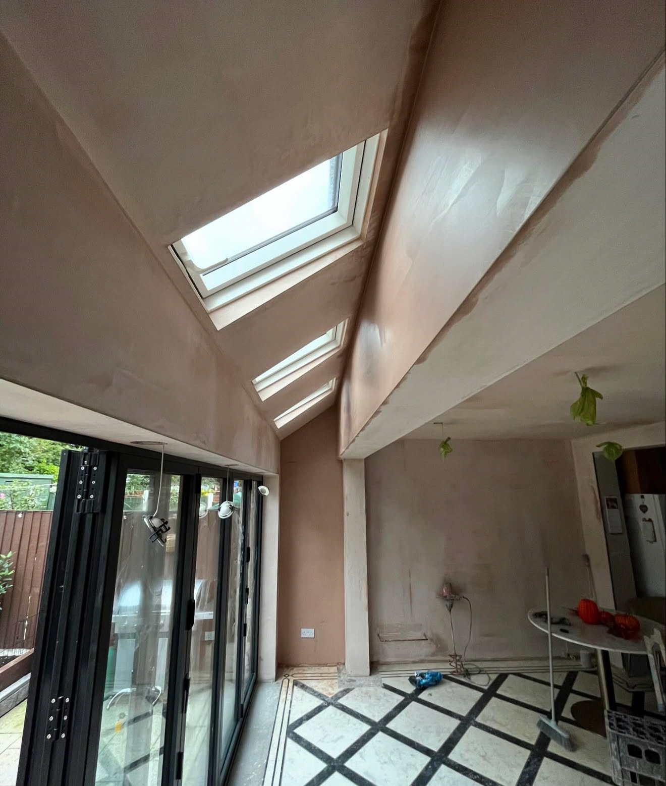 Plastered extension with roof windows