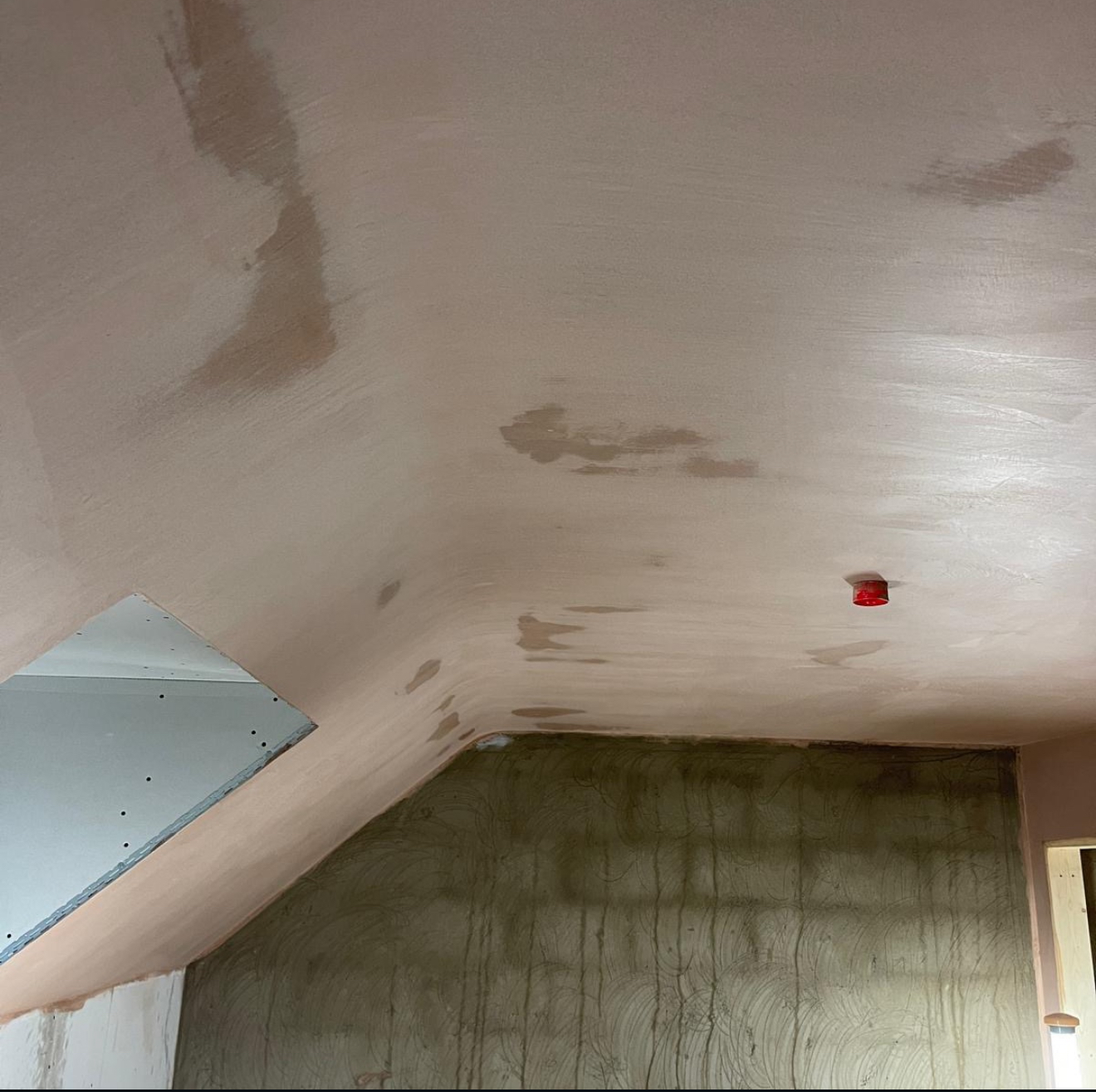 Plastered sloping loft ceiling