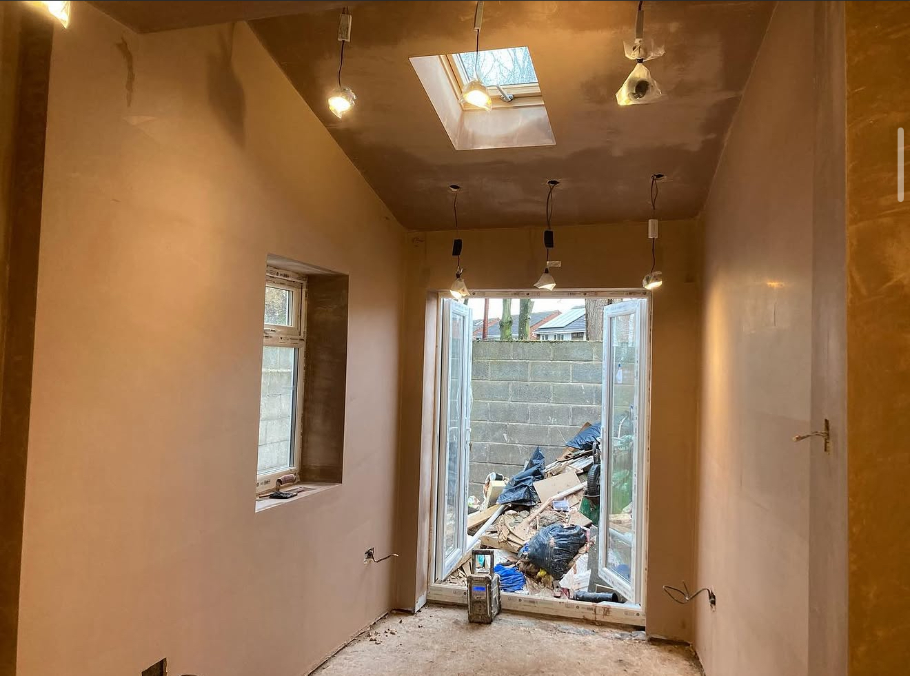 Plastered room with roof windows and lights