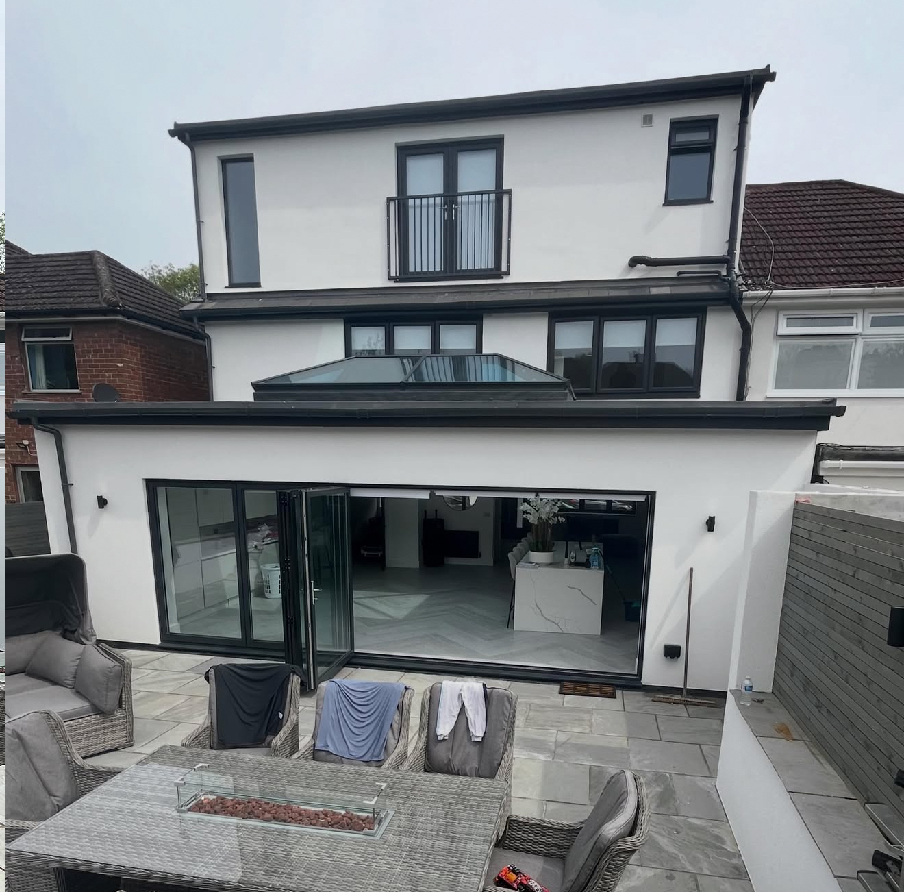 Rendered rear of a house with sliding doors
