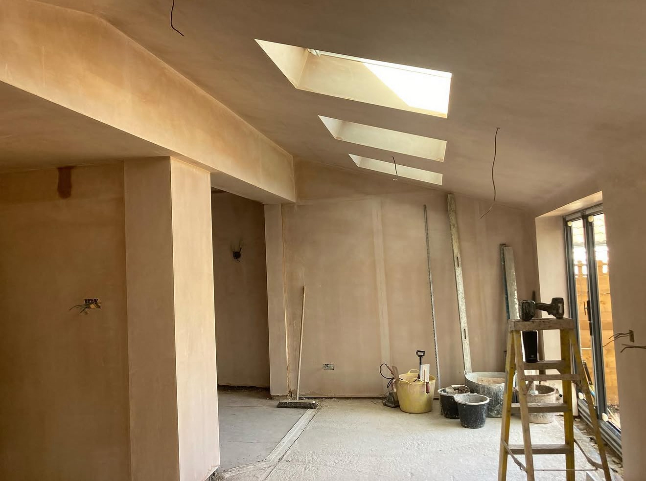 Plastered extension with roof windows