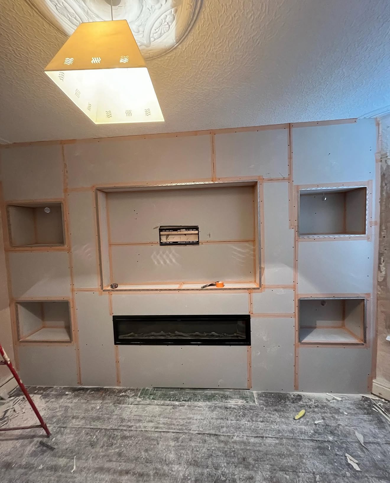Boarded media wall with alcoves