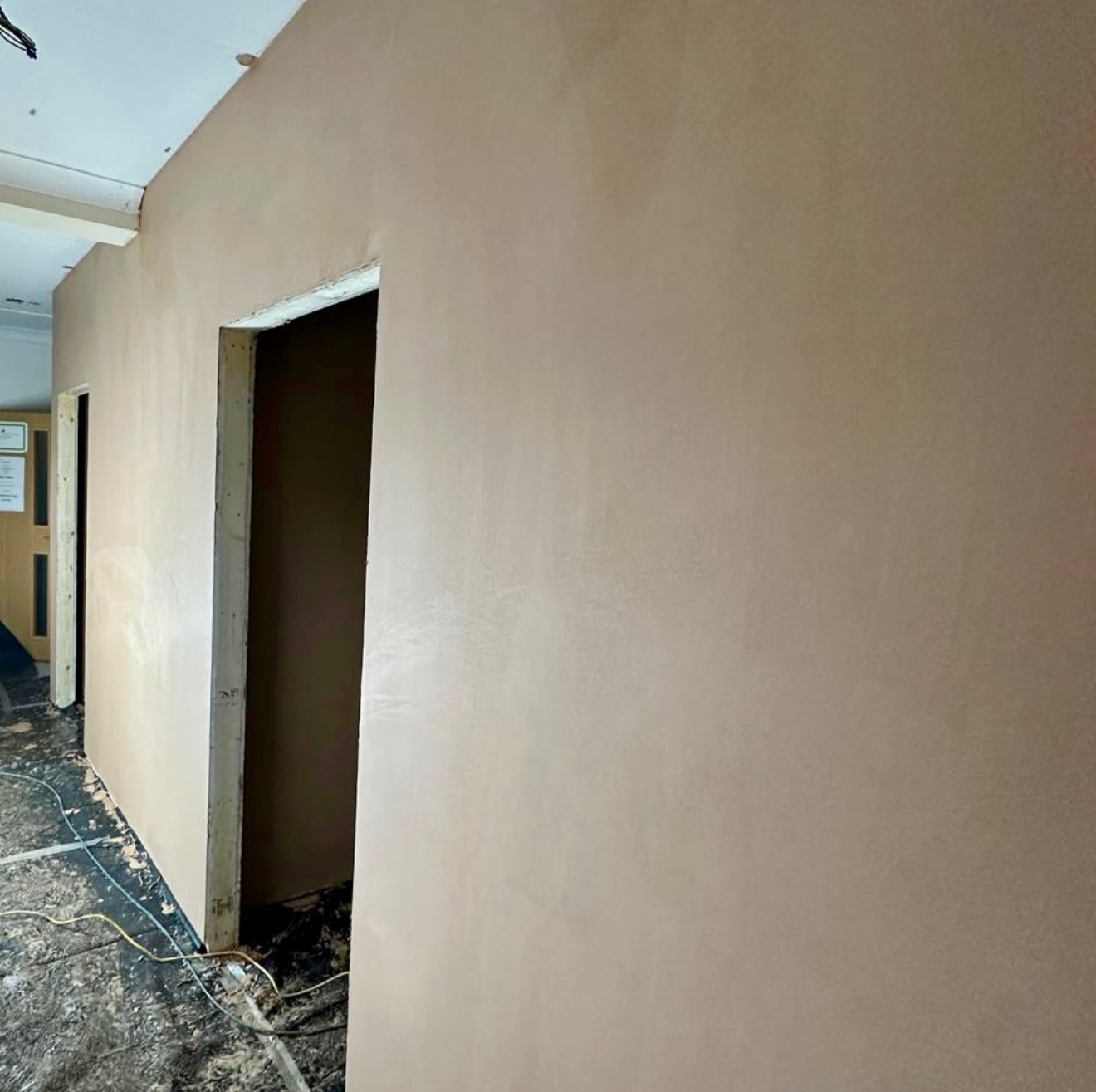 Plastered wall with a doorway