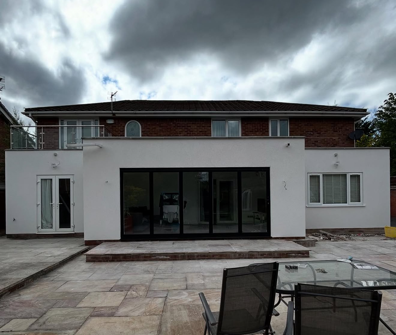 Rendered rear of a house with bi-fold doors