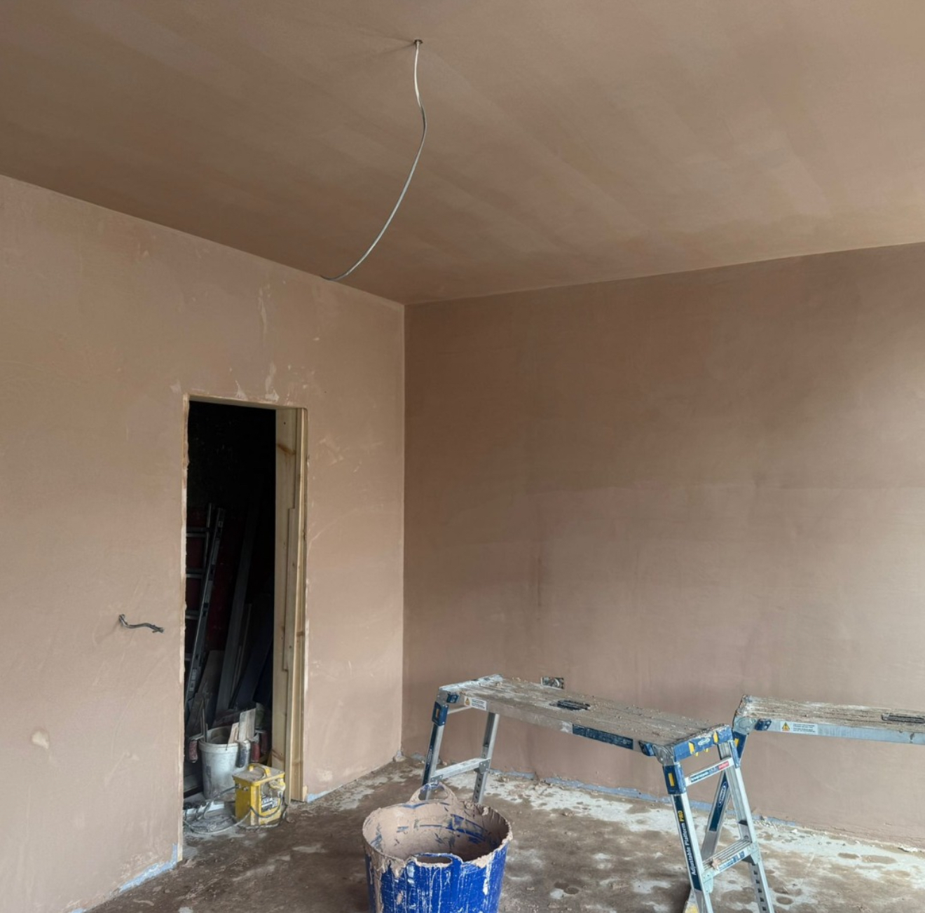 Room with plastered walls and ceiling
