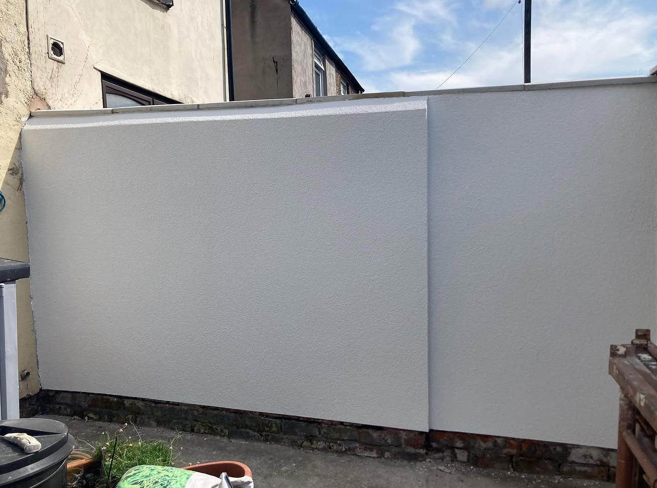 Rendered wall in a back yard